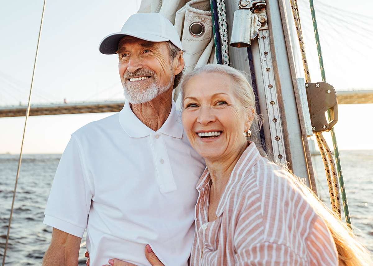 Happy older couple sailing